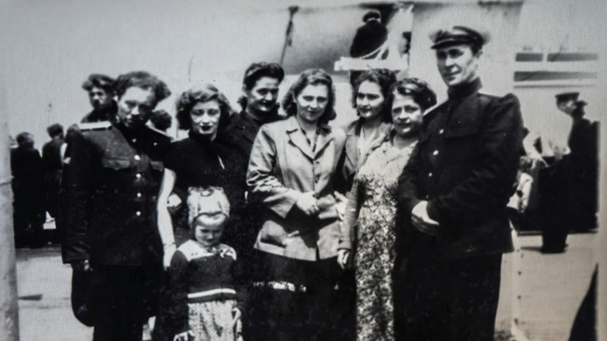 a group of people standing next to each other